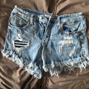 Cut off distressed denim shorts